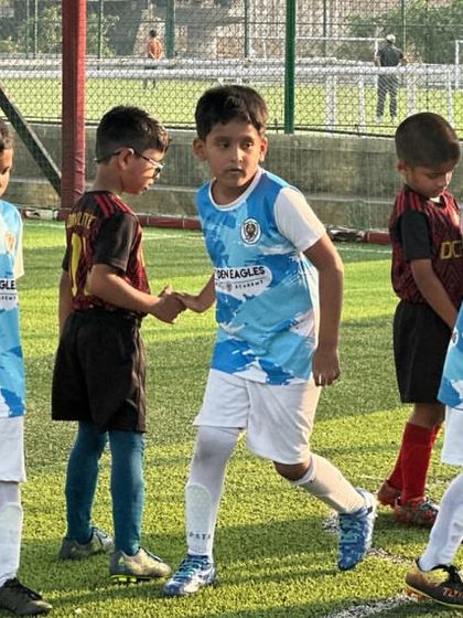 Sportsmanship in action. Our Blue Cubs shake hands with the opposing team, a lesson in respect we teach all our players.