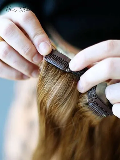 A close-up shot of a clip-in weft being applied, demonstrating the simple and secure application process.