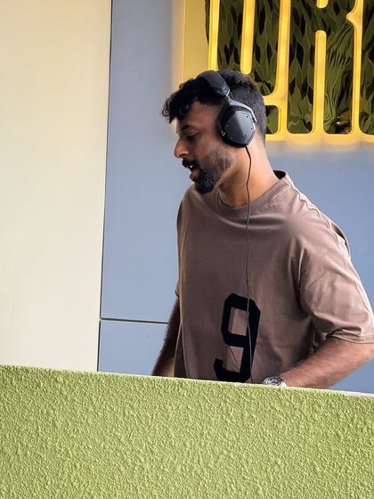 A focused shot of me at the console during a Sunday brunch. It's a different energy from a club, but just as fun.