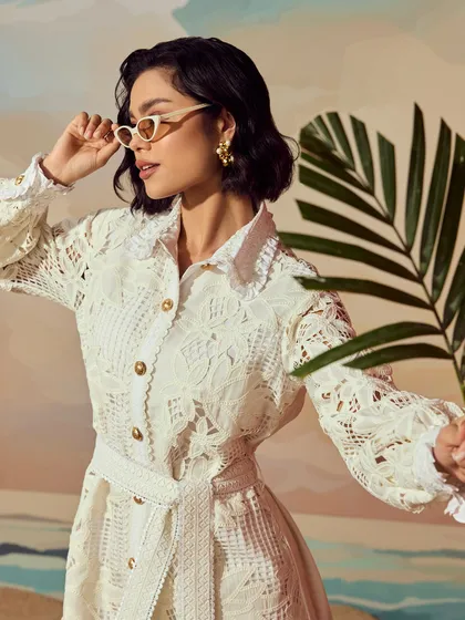 A detailed portrait for Qala Clothing, using a palm leaf as a prop to enhance the tropical theme of the "Casa Solana" collection.