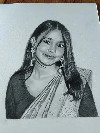 This sketch of a woman in a saree with long earrings is a great example of a classic portrait.