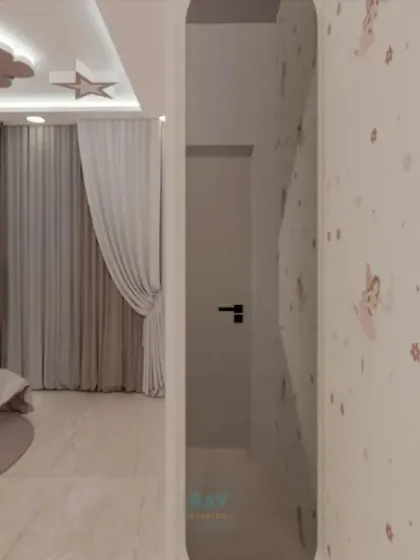 A view of a whimsical kids' room with a pink and white theme, featuring a cloud and star-themed false ceiling.