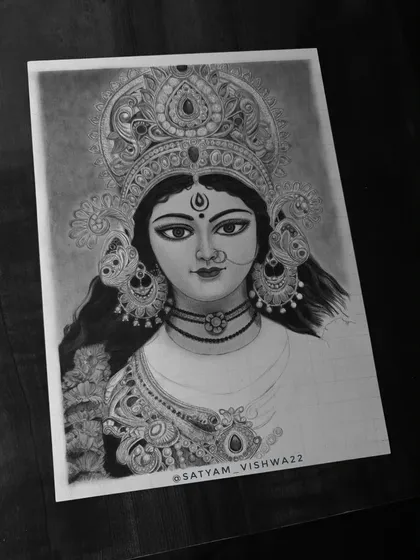 The sketch is almost complete here, with just the final shading on the saree and lower ornaments left. This stage shows the balance between the detailed and unfinished parts of the artwork.