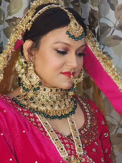 A close-up on the eye makeup and the matha patti. This shows the precision of my work, from the blended eyeshadow to the perfectly placed bindi.
