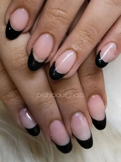 Black French nails are always a vibe. This edgy and chic look is perfect for anyone who loves a darker, more modern manicure.