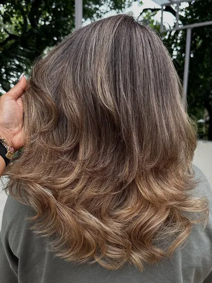 Another look at my 'Vanilla Butter Cream' creation. This is a fantastic way to blend grey hair into a stylish, modern blonde look. The ash tones help neutralize any brassiness for a cool, creamy finish.