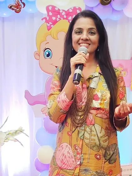 On stage at Ishani's naming ceremony. The decor was absolutely adorable, and it was a pleasure to host an event filled with such love and beautiful music.