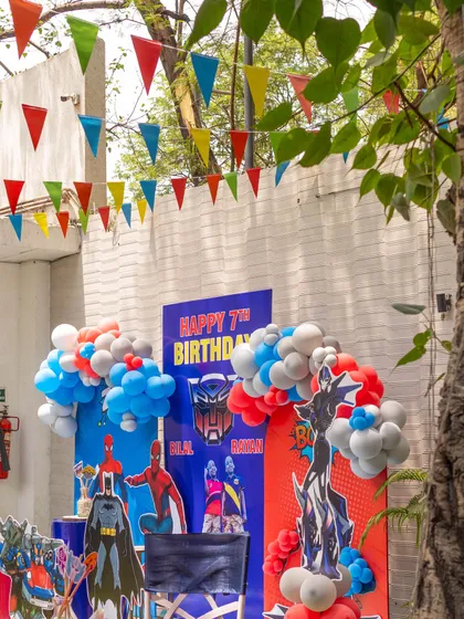 Another angle of the action-packed superhero party decor, showing how we use balloons and banners to create a festive and immersive environment.