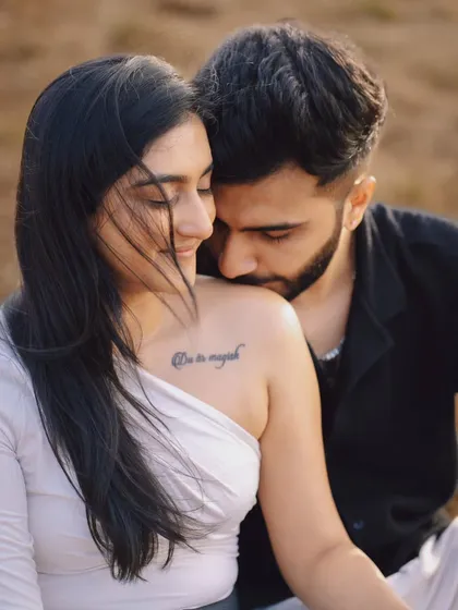 Intimate and romantic. This close-up from a pre-wedding shoot highlights the deep connection between the couple, with a focus on gentle moments and soft emotions. The tattoo adds a personal touch to their story.