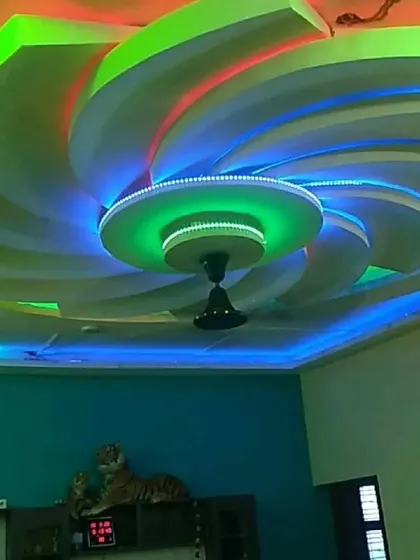 This spiral ceiling uses a rainbow of colors to create a mesmerizing effect. It's a testament to what's possible with creative POP work and modern LED technology.