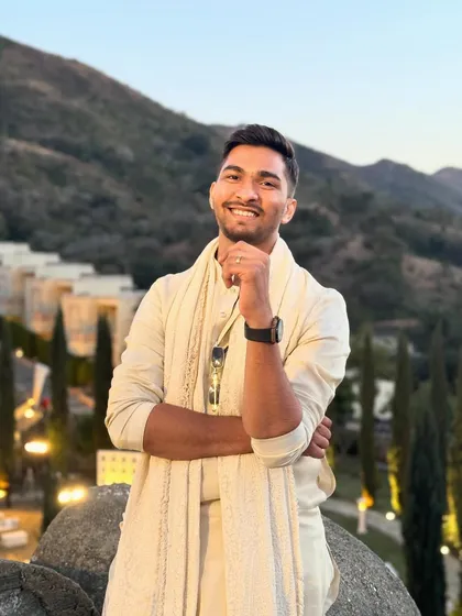 A smiling portrait shot during a destination wedding event. Happy DJ, happy party.