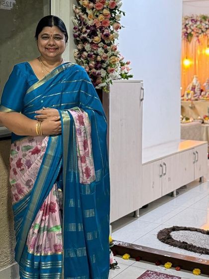 A happy client looking pretty in her pure Mysore crepe digital print saree. The teal and pink combination is so vibrant and beautiful.