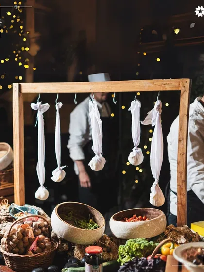 An interactive station where fresh cheese is being made, hung in muslin cloths. This behind the scenes element adds a layer of authenticity and theatre to our grazing tables.