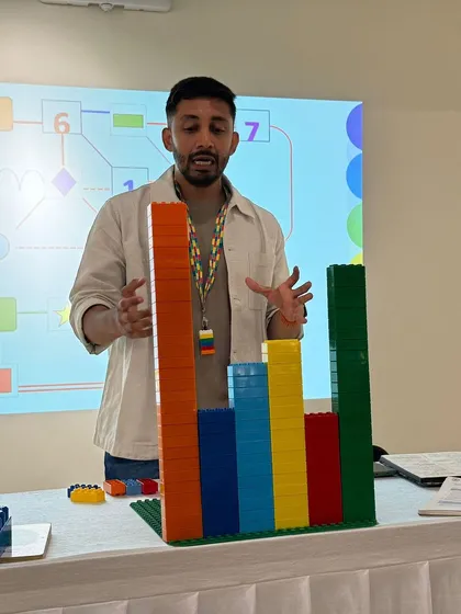 This is a glimpse into our "Six Bricks" teacher training session, led by an expert from SundayBricks. I focus on bringing in specialists to demonstrate how simple tools like LEGO blocks can be used to teach complex concepts and make learning inseparable from play.