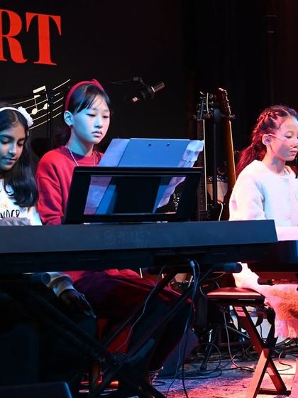 Our budding pianists performing an ensemble piece on multiple keyboards. These performances are fantastic for developing rhythm, listening skills, and the ability to play in perfect sync with others.