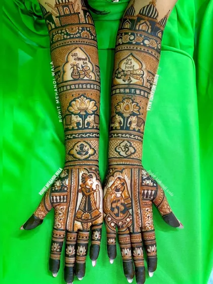 This design combines bride and groom figures with charming, cartoon-style illustrations that tell the couple's story. It also features lotus and elephant motifs, blending modern storytelling with traditional art.