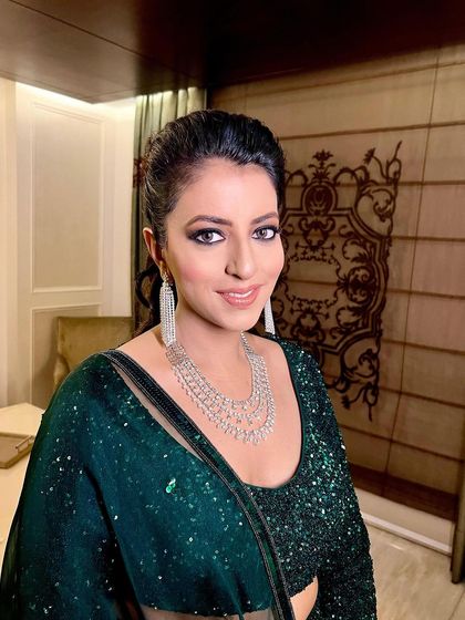 A portrait of the client, her makeup looking flawless and ready for a night out.