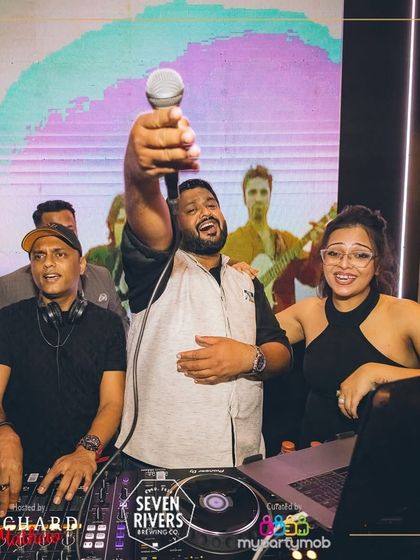 Sharing the mic with the host at IndiGaga. These events are a team effort, and the energy from the hosts and the crowd makes it a collaborative celebration.