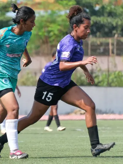 A player on the run, driving the ball forward with pace and determination during a Maharashtra State League match.