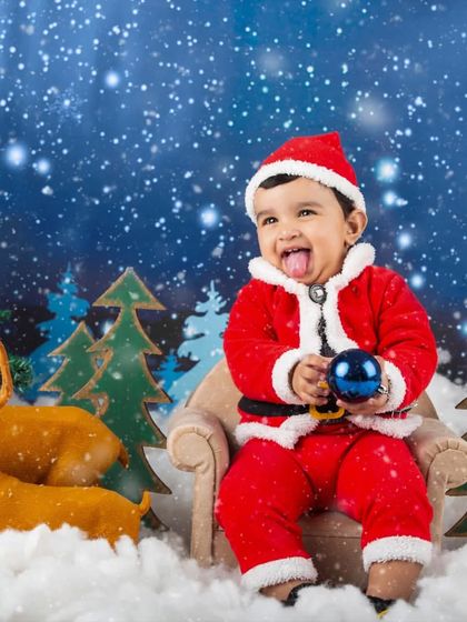 A cheeky little Santa sticking his tongue out. These playful moments are the best ones to capture.
