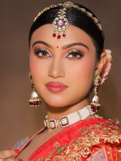A beautiful red-themed bridal look created in the academy. Students learn to work with classic bridal colors to create a timeless and elegant aesthetic.