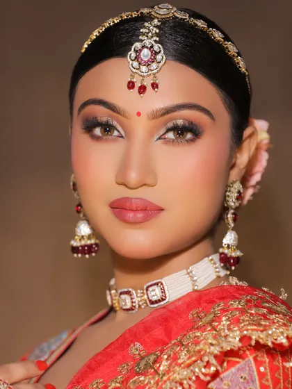 A beautiful red-themed bridal look created in the academy. Students learn to work with classic bridal colors to create a timeless and elegant aesthetic.