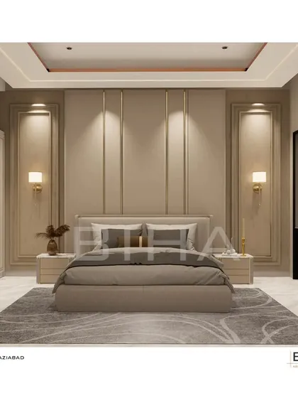 We designed this master bedroom in Ghaziabad as a sanctuary of minimalist elegance. The design centers on a symmetrical, floor-to-ceiling upholstered back panel with integrated brass accents and soft wall sconces. The recessed cove lighting in the ceiling casts a gentle glow, enhancing the serene and calming color palette.