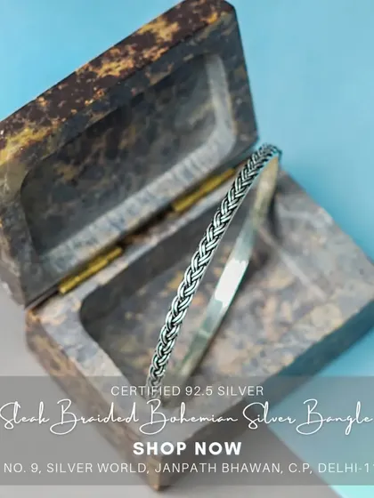 A sleek, braided bohemian-style solid silver bangle. This is a versatile piece that can be worn alone or stacked with other bracelets.