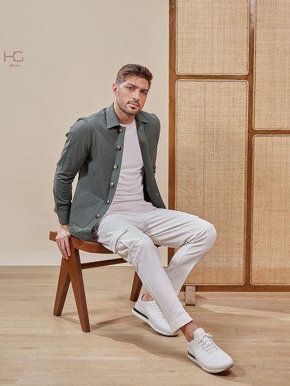 This olive green shacket, styled with white cargo pants, creates a relaxed yet elevated look perfect for a casual dinner or weekend outing.
