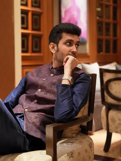 A thoughtful pose, reflecting on the script and the flow of the event. Every detail matters.