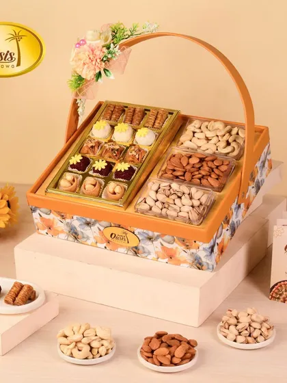 This is one of my classic hamper baskets, perfect for any occasion. It’s a beautiful mix of my signature baklava, fusion sweets, and premium dry fruits like cashews and almonds, all arranged in a floral-themed basket that feels like a celebration in itself.