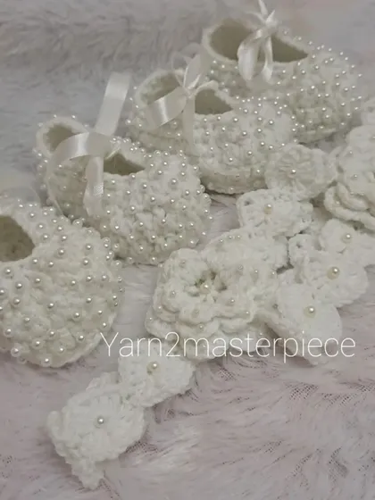 A special order for twins, this set includes two pairs of my white pearl booties and two matching floral headbands, ensuring they are perfectly coordinated.