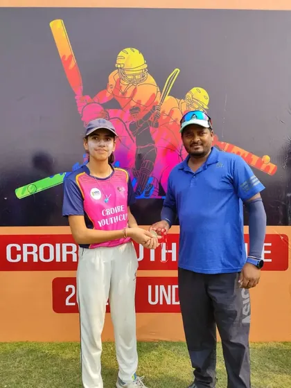 Kanak Bhati receiving the best batter award for her unbeaten half-century.