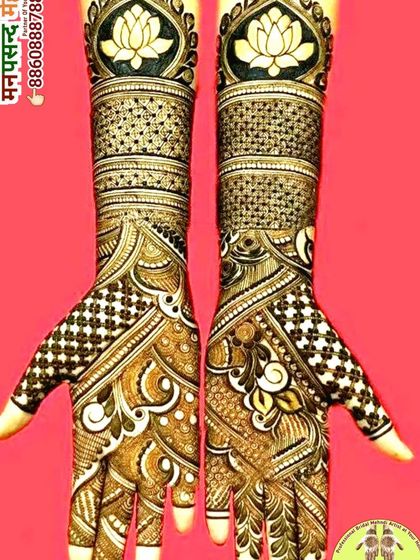 A gorgeous Arabic-style design with bold lotus motifs at the top. The flowing patterns and intricate check-work on the palms create a very elegant and contemporary feel.