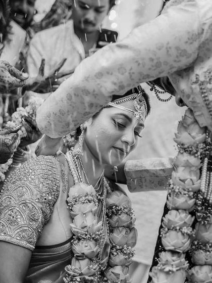 A black and white version of the 'akshata' ceremony. The monochrome effect adds a timeless and emotional depth to this sacred ritual.