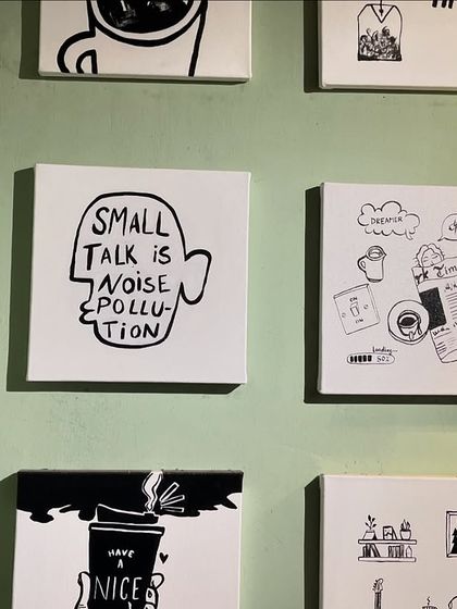 More of the black and white custom art from the Sidewalk Cafe installation. Each 12 by 13 inch canvas features a unique design related to cafe culture.