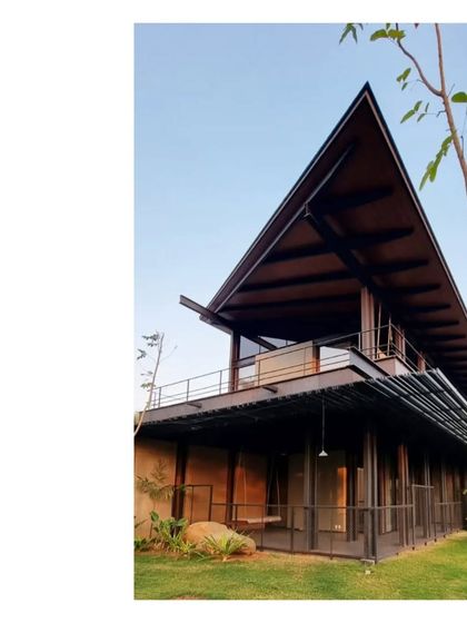 The two-story structure at the Lakeshore house, with its prominent roof and extensive glazing. It is a modern interpretation of a plantation home, designed for tropical living.