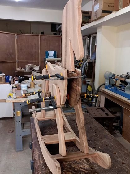 A beautiful rocking horse made from solid wood, clamped up during the glueing process. This is a legacy project, something to be passed down through generations.