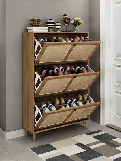 A slim and stylish shoe rack with tilting drawers, perfect for an entryway. The wooden finish and minimalist design keep your footwear organized and out of sight.