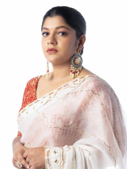 A close up shot highlighting the beautiful drape and Aparna Balamurali's stunning presence.