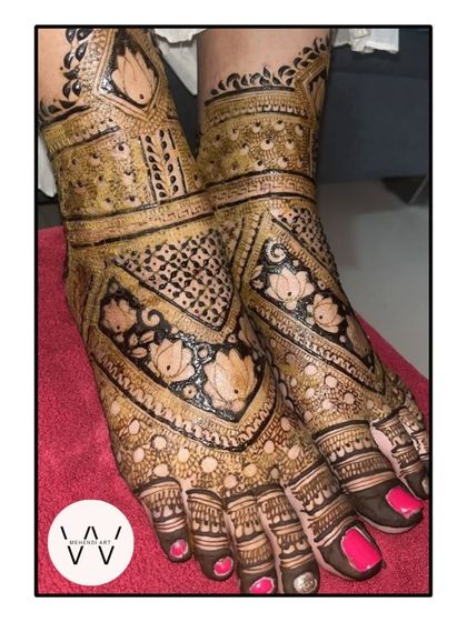 Another angle of this stunning bridal feet henna, showing how the design wraps beautifully around the foot.