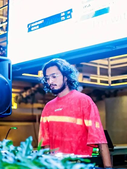 A more relaxed moment at the console, reading the room before the next big drop.