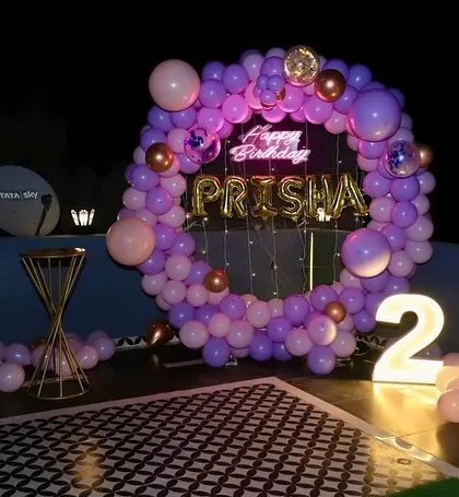A purple and pink version of the ring decoration, showing our flexibility with color palettes to match your preference.