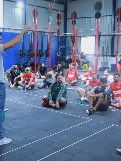 A coach briefs the athletes before an event at The Bengaluru Throwdown. Clear communication and standards are key to a smooth and fair competition.