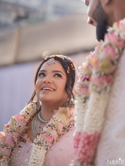 The look of adoration. This shot focuses on the bride's face as she looks up at her groom during the ceremony. Her expression is full of love and admiration, a candid moment that speaks volumes.