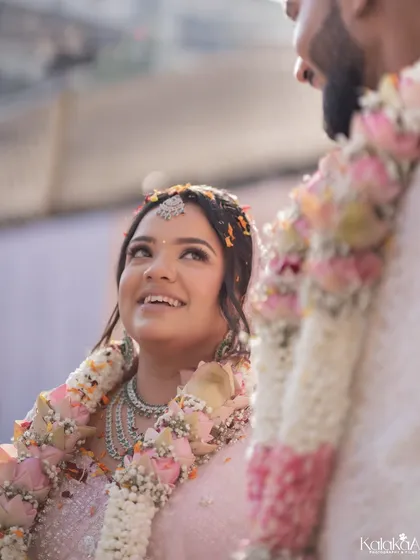 The look of adoration. This shot focuses on the bride's face as she looks up at her groom during the ceremony. Her expression is full of love and admiration, a candid moment that speaks volumes.