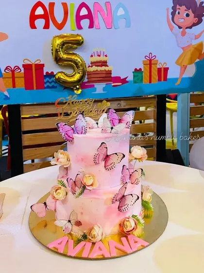The butterfly cake at the 5th birthday party. It looks so beautiful on the celebration table.