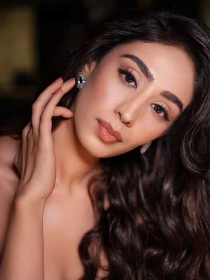 A close-up portrait that showcases the flawless base and soft contour. This minimal glam look is perfect for any party or evening event.