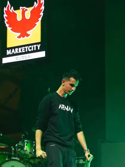 Performing on stage at a large event at Marketcity, Mumbai. I am experienced in working with major brand sponsors and delivering a professional show in diverse concert settings.
