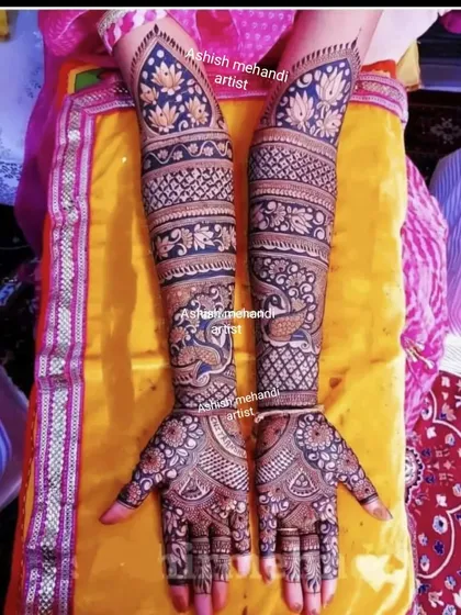 A full-arm design with alternating bands of peacock and lotus motifs, creating a rich and textured pattern.